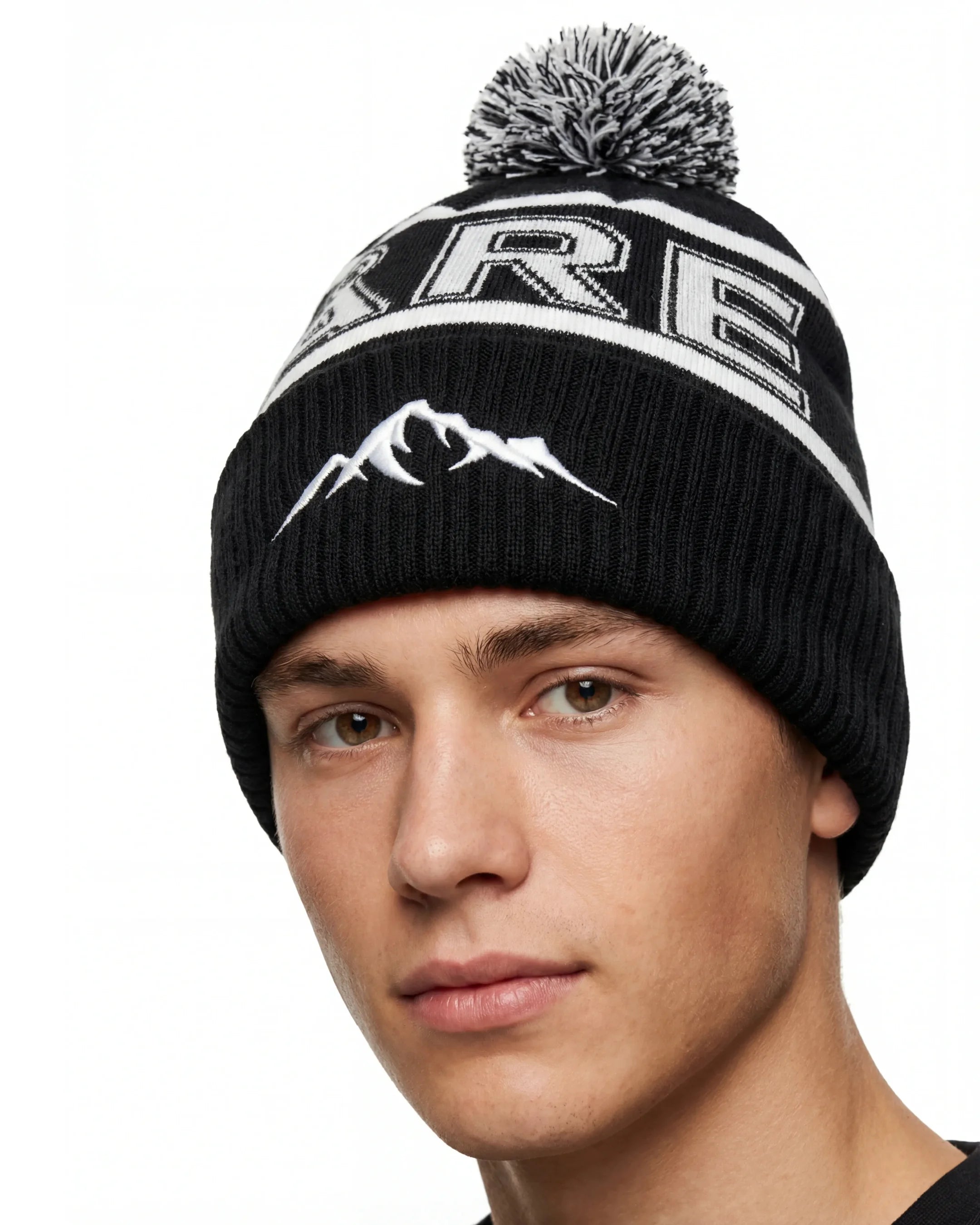 Svart Åre Mössa Med Tofs Närbild